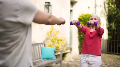 Mid-shot side view of unrecognizable person's hands holding cell phone and Stock Footage 278014973