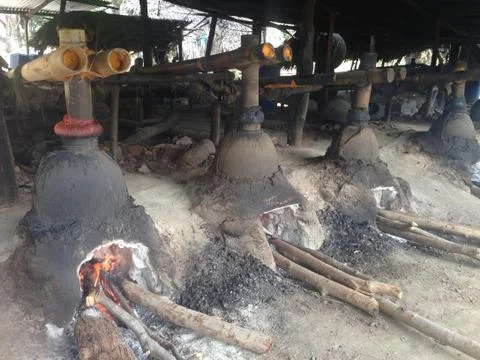 Mid shot of stills, making arak on Flores Island, Indonesia Stock Photos