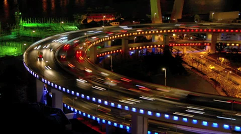 Mid-shot time-lapse of traffic at night on busy ring road in Shanghai, China Vídeo Stock 29797320