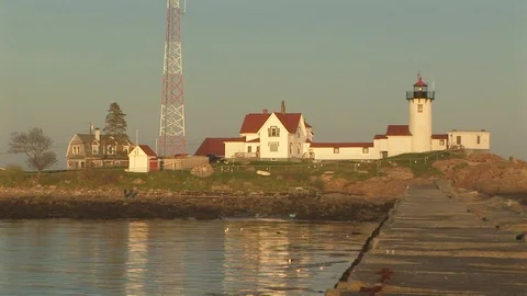 Mid shot view of Eastern Point Lighthouse in Gloucester harbor Massachusetts USA Stock Footage 101981016