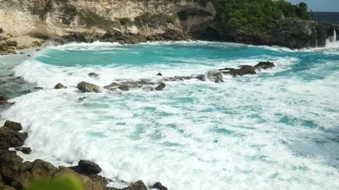MID SHOT OF WAVES BREAKING OVER ROCKS AT BLUE LAGOON Stock Footage 221671117