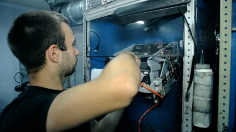 Mid shot Worker clean electronics with compressed air Stock Footage 65511812