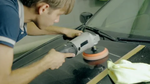 Mid shot Worker polish black car with special tools Stock Footage 65758998