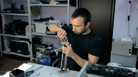 Mid shot Worker repairs electronic stuff Stock Footage 65511709