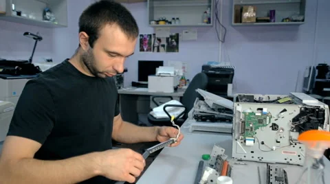 Mid shot Worker repairs electronic stuff Stock Footage 65512153