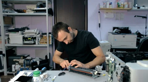 Mid shot Worker repairs electronic stuff Stock Footage 65512182