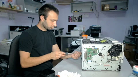 Mid shot Worker repairs electronic stuff Stock Footage 65512696