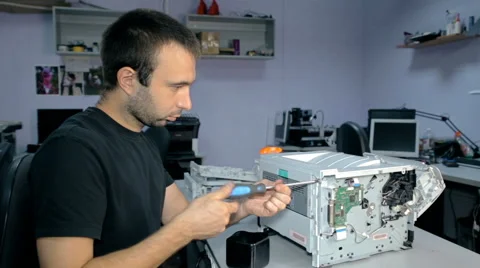 Mid shot Worker repairs electronic stuff Stock Footage 65512816