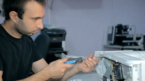Mid shot Worker repairs electronic stuff Stock Footage 65512889