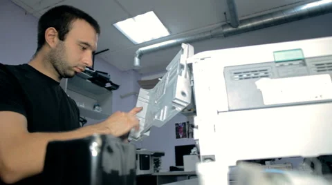 Mid shot Worker repairs electronic stuff Stock Footage 65512926