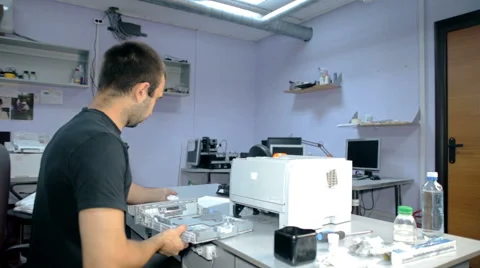 Mid shot Worker repairs electronic stuff Stock Footage 65512971