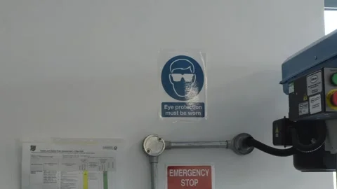 Mid shot in a workshop of an eye protection safety sign. Stock Footage 247401657