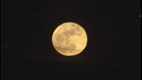 Mid-size plane flies past full moon Stock Footage 78816750