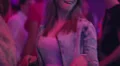 Mid tempo dancing by long haired female in jeans jacket in night club HD Footage