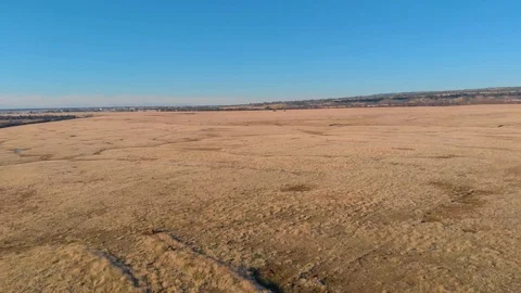 MIDDAY AERIAL FLATLANDS 01 Stock Footage 100052776