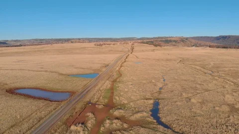 MIDDAY AERIAL FLATLANDS 03 Stock Footage 100052765