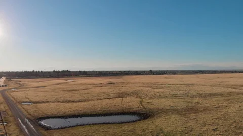 MIDDAY AERIAL FLATLANDS 04 Stock Footage 100052777