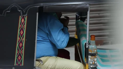 Midday Break: An Auto Rickshaw Driver's Simple Meal Stock Footage 301191573