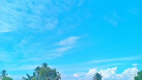 Midday Fluffy Clouds over Peaceful Village Countryside Landscape Stock Photos