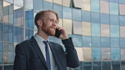 Middle age Attractive Businessman Using Smartphone and Speaking with his Stock Footage 145282811
