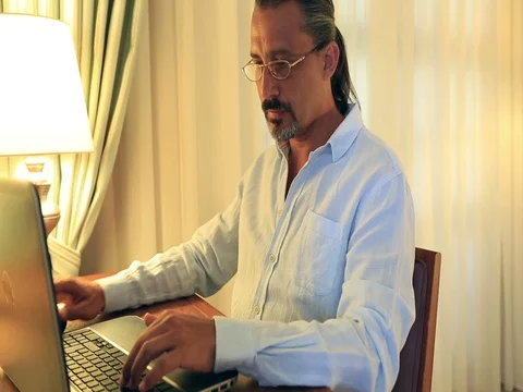 Middle age attractive handsome using laptop Video stock 73610156