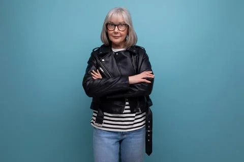 Middle age business. 60s mature woman in gray hair in a stylish youth look looks Stock Photos