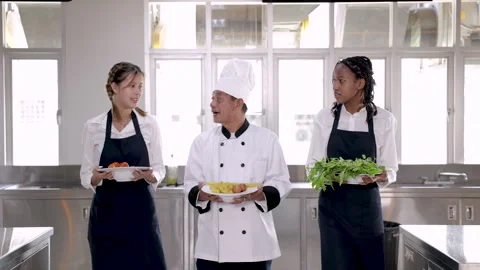 Middle age chef man acting head or master teaching multiethnic staff traine.. Stock Footage 246721249