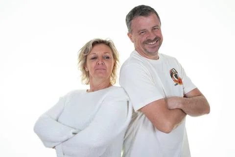 Middle age couple back to back arms crossed woman man in white background Stock Photos