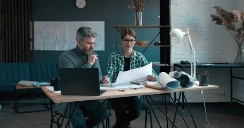 Middle age Engeneer Chief, talks with Interior Designer, Explaining things Stock Footage 147860330
