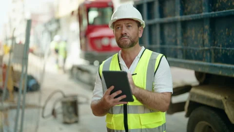 Middle age man architect drawing on touchpad at street Video stock 230918284