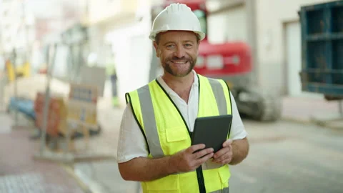 Middle age man architect using touchpad at street Video stock 230023751