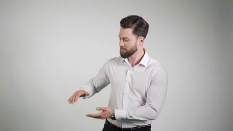 Middle age man, with beard holding something, size concept. SWhows something Vídeo Stock 114577275