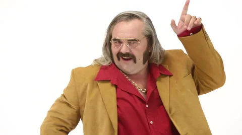 Middle age man dressing 70s brown red vintage clothes makes dance Stock Footage 64539038