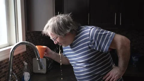 Middle age Man Drinking and Spits Out Bad Taste Coffee Stock Footage 236641403