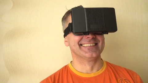 Middle age Man Experiencing Virtual Reality - 360 Movie VR Video 3D - New Stock Footage 72073177
