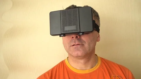 Middle age Man Experiencing Virtual Reality - 360 Movie VR Video 3D - New Stock Footage 72076013