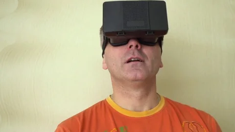 Middle age Man Experiencing Virtual Reality - 360 Movie VR Video 3D - New Stock Footage 72076120