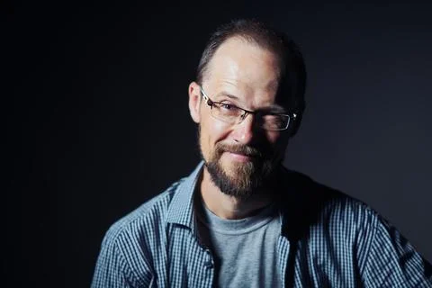 Middle age man looking with distrust expression at camera Foto stock