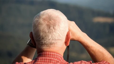 A Middle Age Man Looking Through Binoculars  動画素材 127105769