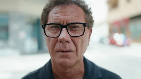 Middle age man with relaxed expression standing at street Stock-Footage 206664905