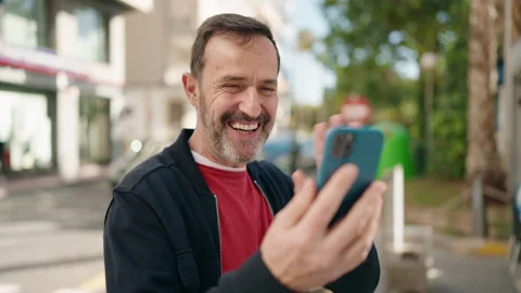Middle age man smiling confident having video call at street Video stock 171816463
