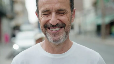 Middle age man smiling confident standing at street Stock Footage 212734057