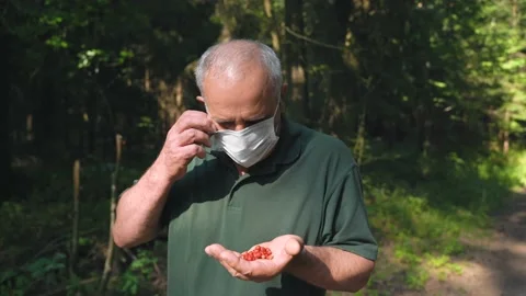 Middle age man is taking off his medicine mask from his face Stock Footage 157072364