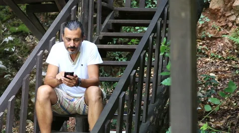 Middle age man talking smartphone Stock Footage 41325426