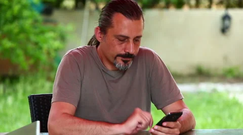 Middle age man talking smartphone Stock Footage 50130108