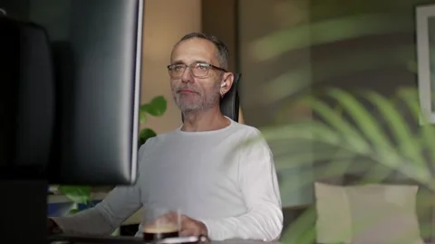 Middle age man working from home. Video stock 220450167