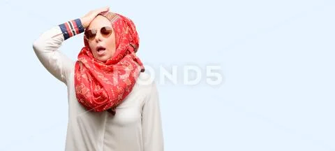 Middle age muslim arab woman wearing hijab terrified and nervous expressing a Stock Photos