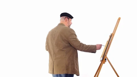 Middle age painter in jacket paint a picture white screen Stock Footage 105002014
