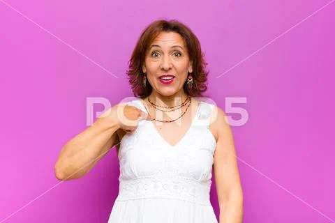 Middle age woman panicking over a forgotten deadline, feeling stressed, havin Stock Photos