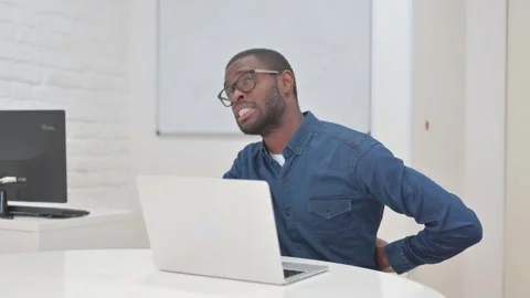 Middle Aged African Man with Back Pain at Work Stock Footage 309512048